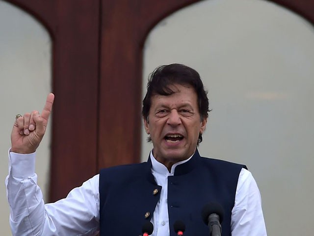 Pakistan's Prime Minister Imran Khan addresses the nation outside the Prime Minister Secretariat building in Islamabad on August 30, 2019. - Prime Minister Imran Khan vowed to continue fighting for Kashmir until the disputed Himalayan territory was "liberated" as thousands rallied across Pakistan on August 30 in mass demonstrations protesting Delhi's actions in Indian-administered Kashmir in the most ambitious public protests targeting India in years. (Photo by AAMIR QURESHI / AFP) (Photo credit should read AAMIR QURESHI/AFP/Getty Images)