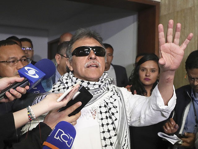 Former FARC rebel Jesus Santrich talks to journalists after swearing in to take his congressional seat in Bogota, Colombia, Tuesday, June 11, 2019. Santrich was unable to take up his seat in congress last year when he was jailed awaiting extradition to the U.S. on drug charges, but was released …