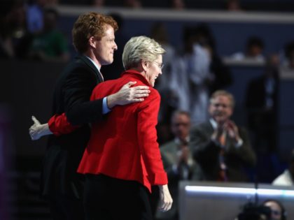 PHILADELPHIA, PA - JULY 25: Sen. Elizabeth Warren (D-MA) embraces Rep. Joseph P. Kennedy, III (D-MA) (L) after being introduced on the first day of the Democratic National Convention at the Wells Fargo Center, July 25, 2016 in Philadelphia, Pennsylvania. An estimated 50,000 people are expected in Philadelphia, including hundreds …