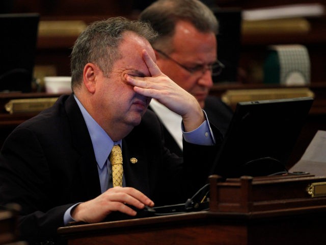 Pennsylvania Rep. John Galloway, D-Bucks, rubs his eyes as he sits in front of his laptop