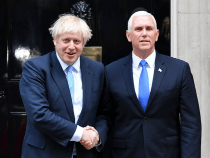 Britain's Prime Minister Boris Johnson (L) greets US Vice-President Mike Pence (R) outside