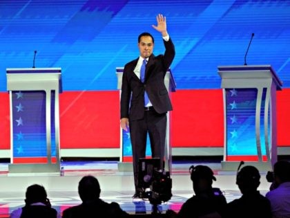 former Housing and Urban Development Secretary Julian Castro waves as he takes the stage Thursday, Sept. 12, 2019, during a Democratic presidential primary debate hosted by ABC at Texas Southern University in Houston. (AP Photo/David J. Phillip)