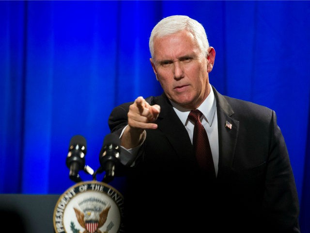 Vice President Mike Pence points to an audience member after addressing the In Defense of