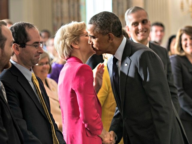 US President Barack Obama leans in to kiss Senator Elizabeth Warren (D-MA) after making a statement in the State Dining Room of the White House July 17, 2013 in Washington, DC. Obama spoke about the recent confirmation of Cordray, as the Director of the Consumer Financial Protection Bureau who was …