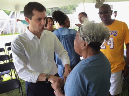 Democratic presidential candidate and South Bend, Indiana mayor Pete Buttigieg greets residents during a community building event hosted by Christ Temple Apostolic Church on June 29, 2019 in South Bend, Indiana. The event was held as the funeral for Eric Logan was being held in nearby Mishawaka. Logan was shot …