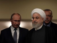 Turkish President Recep Tayyip Erdogan, right, Russia's President Vladimir Putin, left, and Iran's President Hassan Rouhani arrive for a news conference in Ankara, Turkey, Monday, Sept. 16, 2019. The leaders of Russia, Iran and Turkey met in the Turkish capital to discuss the situation in Syria, with the aim of …
