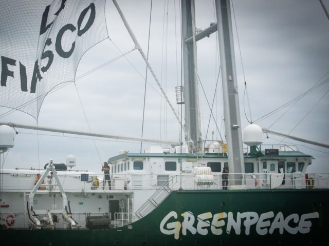 Greenpeace activists raise a banner reading "EPR, a fiasco" aboard the Rainbow Warrior III ship as they take part in an action against the future Flamanville nuclear power plant (Evolutionary Power Reactor of Flamanville) off La Hague, in the English Channel, on August 16, 2019. - The Rainbow Warrior III …