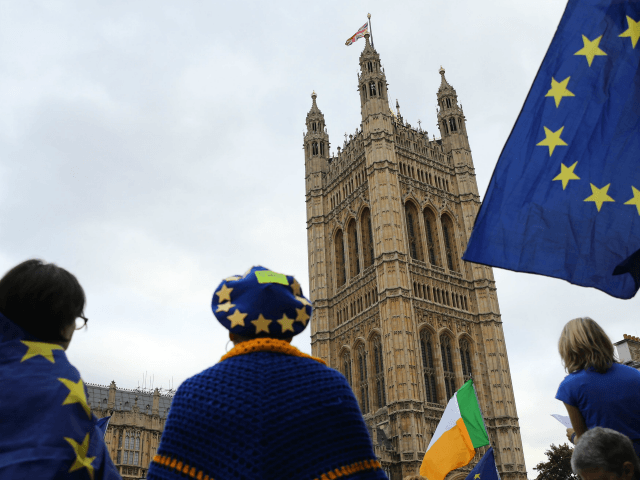 Pro-Europe supporters gather beside the Victoria Tower, where all the original documents created in over 500 years of the British Houses of Parliament are kept, in central London as protests continue outside the Palace of Westminster in central London on September 3, 2019. - The fate of Brexit hung in …