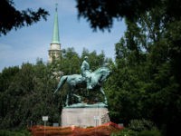 A statue of Confederate General Robert E. Lee stands at Emancipation Park August 10, 2018 near downtown Charlottesville, Virginia, site of the Unite the Right rally held one year ago this weekend. - Virginia Governor Ralph Northam and the city of Charlottesville have declared a state of emergency ahead of …