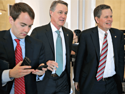 WASHINGTON, DC - FEBRUARY 04: Sen. David Perdue (R-GA) (C) and Sen. Steve Daines (R-MT) (R) leave a Senate bipartisan lunch in the Russell Senate Office Building on Capitol Hill February 4, 2015 in Washington, DC. Senators from both parties said they did not talk about current legislation during the …
