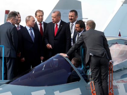 Russian President Vladimir Putin (3rd R) and his Turkish counterpart Recep Tayyip Erdogan (4th L) inspect Sukhoi Su-57 fifth-generation fighter during the MAKS-2019 International Aviation and Space Salon opening ceremony in Zhukovsky outside Moscow on August 27, 2019. (Photo by Maxim SHIPENKOV / POOL / AFP) (Photo credit should read …