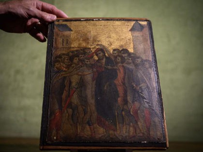 TOPSHOT - This photo taken on September 23, 2019 in Paris shows a painting entitled "the Mocking of Christ" by the late 13th century Florentine artist Cenni di Pepo also known as Cimabue. - The painting will be auctioned in Senlis on October 27, 2019. (Photo by Philippe LOPEZ / …