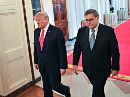 US President Donald Trump (L) and Attorney General William Barr arrive to present the Medal of Valor and Heroic Commendations to officers and civilians who responded to mass shootings in Dayton, Ohio and El Paso, Texas, in the East Room of the White House in Washington, DC on September 9, …