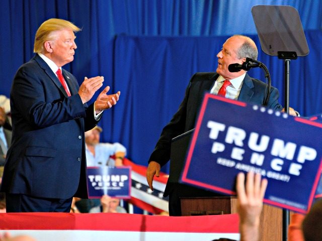 US President Donald Trump speaks with US Congressional candidate Dan Bishop (R) during a &