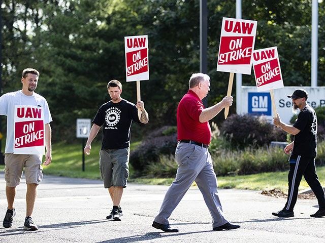 Union members picket outside a General Motors facility in Langhorne, Pa., Monday, Sept. 16, 2019. More than 49,000 members of the United Auto Workers walked off General Motors factory floors or set up picket lines early Monday as contract talks with the company deteriorated into a strike. (AP Photo/Matt Rourke)