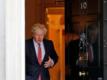 Britain's Prime Minister Boris Johnson walks out to welcome the Emir of Qatar, Sheikh Tami