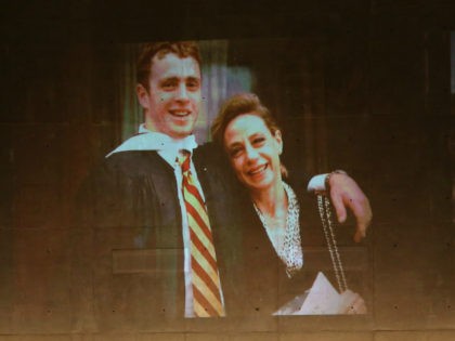 U.S. President Barack Obama speaks about Welles Crowther, pictured on the screen with his mother Alison, during the dedication ceremony at the National September 11 Memorial Museum May 15, 2014 in New York City. The museum spans seven stories, mostly underground, and contains artifacts from the attack on the World …
