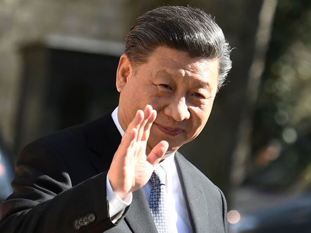 Chinese president Xi Jinping waves as he arrives for a meeting with French French Prime minister at the Matignon hotel in Paris on March 26, 2019. (Photo by Bertrand GUAY / AFP) (Photo credit should read BERTRAND GUAY/AFP/Getty Images)