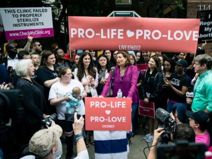 Ashley Garecht speaks as anti-abortion protesters rally near a Planned Parenthood clinic i