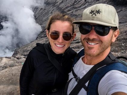 Jolie King and Mark Firkin take a selfie in front of a volcano in Indonesia. Facebook