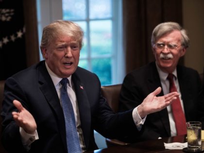 US President Donald Trump speaks during a meeting with senior military leaders at the White House in Washington, DC, on April 9, 2018. At right is new National Security Advisor John Bolton. President Donald Trump said Monday that "major decisions" would be made on a Syria response in the next …