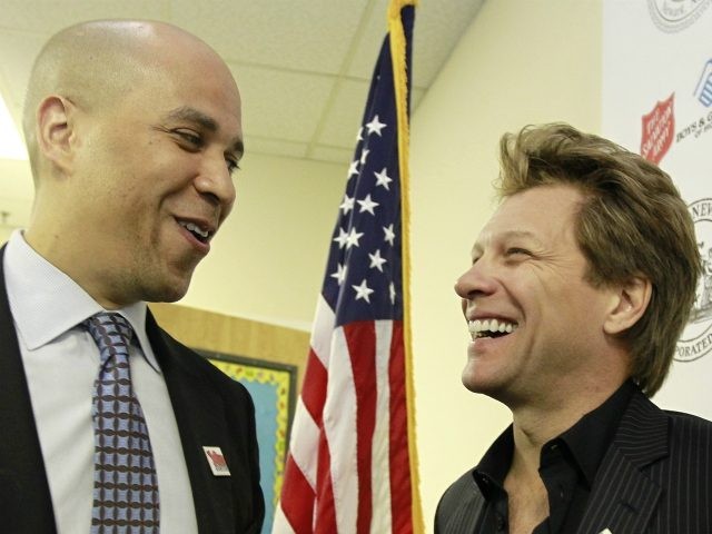 Musician Jon Bon Jovi, right, and Newark Mayor Cory Booker talk during a visit to Youth Ed