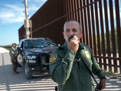 PENITAS, TEXAS - SEPTEMBER 10: U.S. Border Patrol agent Carlos Ruiz spots a pair of undocumented immigrants while coordinating with active duty U.S. Army soldiers near the U.S.-Mexico border fence on September 10, 2019 in Penitas, Texas. U.S. military personnel deployed to the border assist U.S. Border Patrol agents with …