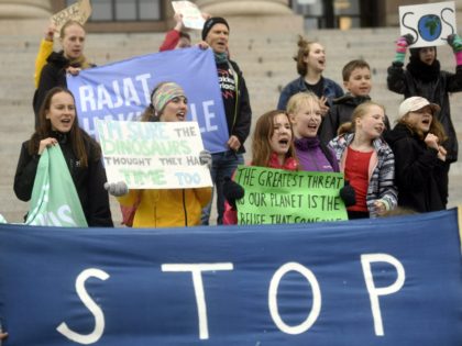 Young climate activists demonstrate in front of the Finnish Parliament building in Helsinki, Finland, on May 24, 2019, a global day of student protests aiming to spark world leaders into action on climate change. - In a shift since the last European Parliament elections, mainstream parties have adopted climate change …
