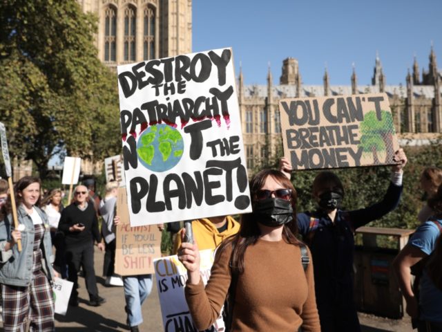 Protesters hold banners as they attend the Global Climate Strike on September 20, 2019 in