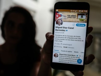 A person holds a smartphone showing the twitter account of Cuban President Miguel Diaz-Canel, in Havana, on October 10, 2018. - Diaz-Canel is the first Cuban President who opens an account on twitter. (Photo by ADALBERTO ROQUE / AFP) (Photo credit should read ADALBERTO ROQUE/AFP/Getty Images)