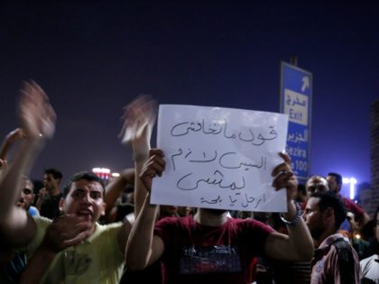Egyptian protesters shout slogans as they take part in a protest calling for the removal o