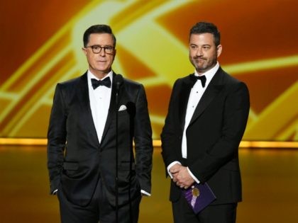 LOS ANGELES, CALIFORNIA - SEPTEMBER 22: (L-R) Stephen Colbert and Jimmy Kimmel speak onsta