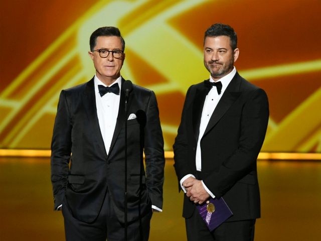 LOS ANGELES, CALIFORNIA - SEPTEMBER 22: (L-R) Stephen Colbert and Jimmy Kimmel speak onstage during the 71st Emmy Awards at Microsoft Theater on September 22, 2019 in Los Angeles, California. (Photo by Kevin Winter/Getty Images)