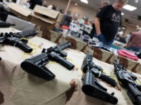 NAPLES, FLORIDA - NOVEMBER 24: Guns stand for sale at a gun show on November 24, 2018 in Naples, Florida. According to recently released data from the U.S. centers for Disease Control and Prevention, suicides and homicides involving guns have been increasing in America. The report, which faced a large …
