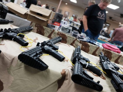 NAPLES, FLORIDA - NOVEMBER 24: Guns stand for sale at a gun show on November 24, 2018 in N