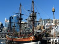 Workers busy in minor repair work of the Australian-built replica of James Cook's HMB Endeavour at the western shore of Sydney's Darling Harbour on July 3, 2013. Australia's central bank gave a strong signal it may continue cutting interest rates to cushion the economy as a long mining boom slows. …