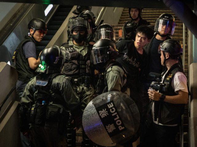 HONG KONG, CHINA - SEPTEMBER 08: Police arrest a protester in Mong Kok on September 08, 20