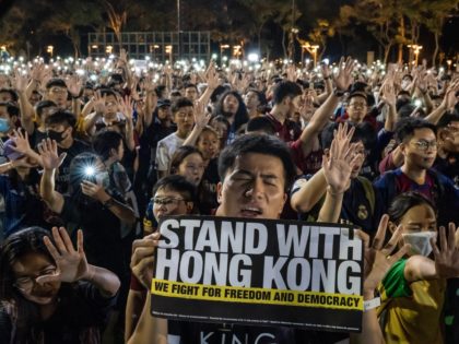 HONG KONG, CHINA - SEPTEMBER 18: Pro-democracy football fans gather to form a human chain as they sing songs and shout slogans at Victoria Park on September 18, 2019 in Hong Kong, China. Pro-democracy protesters have continued demonstrations across Hong Kong, calling for the city's Chief Executive Carrie Lam to …