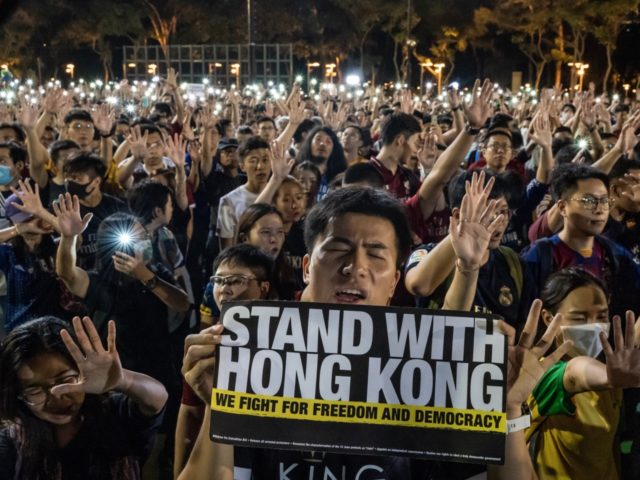 HONG KONG, CHINA - SEPTEMBER 18: Pro-democracy football fans gather to form a human chain