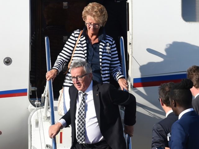 President of the European Commission Jean-Claude Juncker and his wife Christiane Frising step out of their plan upon their arrival at the airport in Hamburg, northern Germany on July 6, 2017 to attend the G20 meeting. Leaders of the world's top economies will gather from July 7 to 8, 2017 …