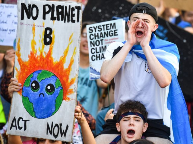 EDINBURGH, SCOTLAND - SEPTEMBER 20: Protesters march and hold placards as they attend the