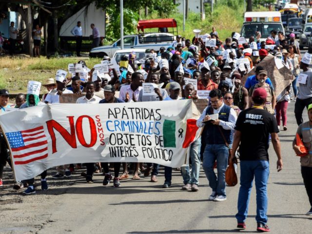 African migrants march to demand humanitarian visas that would enable them to cross Mexico