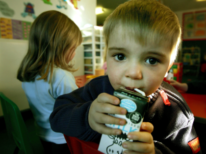 GLASGOW, SCOTLAND - JANUARY 28: A three-year-old boy drinks milk at a private nursery school January 28, 2005 in Glasgow, Scotland. The average price of pre-school care has increased over the past year, sending child care prices to an average of GBP200 in parts of the southeast. Many working parents …