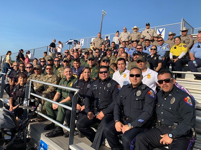 officers at football game