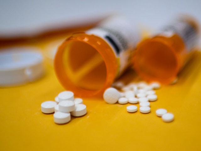 This illustration image shows tablets of opioid painkiller Oxycodon delivered on medical prescription taken on September 18, 2019 in Washington,DC. - Millions of Americans sank into addiction after using potent opioid painkillers that the companies churned out and doctors freely prescribed over the past two decades. Well over 400,000 people died of opioid overdoses in that period, while the companies involved raked in billions of dollars in profits. And while the flood of prescription opioids into the black market has now been curtailed, addicts are turning to heroin and highly potent fentanyl to compensate, where the risk of overdose and death is even higher. (Photo by Eric BARADAT / AFP) (Photo credit should read ERIC BARADAT/AFP/Getty Images)