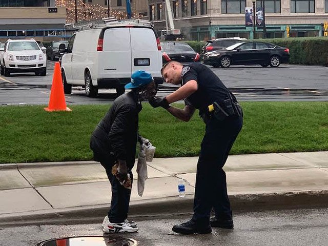 policeman helps shave man