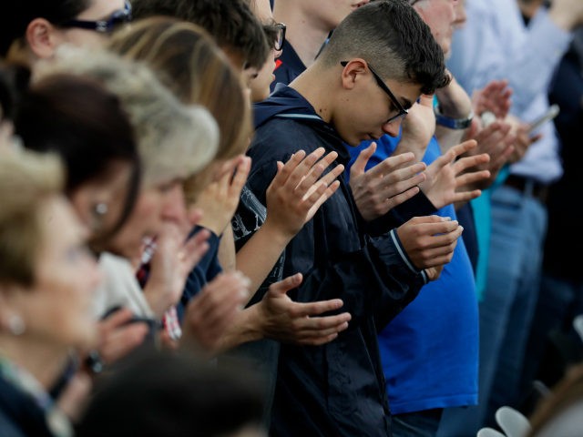 Faithful pray during a meeting with Pope Francis on the occasion of the 50th anniversary of the Neocatechumenal Way, one of the Catholic Church's biggest missionary movement, in Rome's Tor Vergata neighborhood, Saturday, May 5, 2018. Pope Francis is urging the missionary movement to respect different cultures and not try …