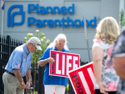 Anti-abortion demonstrators hold a protest outside the Planned Parenthood Reproductive Hea