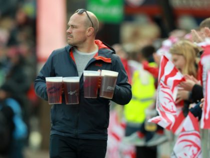 GLOUCESTER, ENGLAND - APRIL 13: A supporter carries beer during the Gallagher Premiership Rugby match between Gloucester Rugby and Bath Rugby at Kingsholm Stadium on April 13, 2019 in Gloucester, United Kingdom. (Photo by David Rogers/Getty Images)