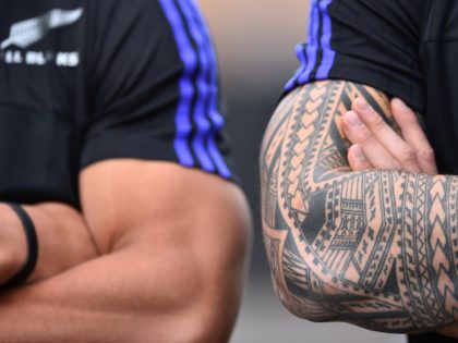 New Zealand All Blacks centre Sonny Bill Williams 's tattoo (R) is pictured during a community coaching event with young players of the London Harlequins in London on September 13, 2015 ahead of the 2015 Rugby Union World Cup. The All Blacks will play against Argentina next September 20 for …
